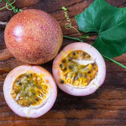 Fresh Purple Passion Fruit sliced open with juicy golden pulp, perfect for tropical gardens and exotic fruit lovers. HarvestNest Seeds